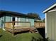 Back deck with stairs leading to the yard at 847 Hand Ave, Sarasota, FL 34232