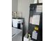 Laundry room with Whirlpool water heater and HVAC unit at 847 Hand Ave, Sarasota, FL 34232