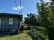 Side view of house showcasing backyard and shed at 847 Hand Ave, Sarasota, FL 34232