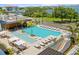 Stunning aerial view of resort-style pool and surrounding area at 1020 Sunset Point Rd Rd # 405, Clearwater, FL 33755