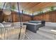 Hot tub with hanging chairs and wooden privacy walls at 1020 Sunset Point Rd Rd # 405, Clearwater, FL 33755