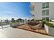 Relaxing outdoor lounge area with wooden deck and seating at 1020 Sunset Point Rd Rd # 405, Clearwater, FL 33755