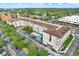 Aerial view of an apartment building with a pool and ample parking at 1216 S Missouri S Ave # 222, Clearwater, FL 33756