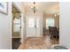 Light and airy entryway with a decorative tile floor and views to other rooms at 1433 Emerald Hill Way, Valrico, FL 33594