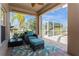 Covered lanai with seating area overlooking pool at 1433 Emerald Hill Way, Valrico, FL 33594