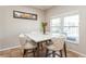 Casual breakfast nook features a marble table and four upholstered chairs at 1433 Emerald Hill Way, Valrico, FL 33594