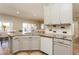 Spacious kitchen with granite island and light gray cabinets at 1433 Emerald Hill Way, Valrico, FL 33594