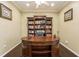 Spacious home office with built-in bookcases and a large desk at 1433 Emerald Hill Way, Valrico, FL 33594