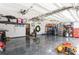 Spacious garage with overhead storage and epoxy floor at 1433 Emerald Hill Way, Valrico, FL 33594