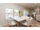 Bright breakfast nook with marble table and four chairs, offering pool views at 1433 Emerald Hill Way, Valrico, FL 33594