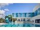 Community pool with a slide and adjacent building at 1757 New Hampshire Ne Ave, St Petersburg, FL 33703