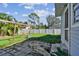 Large backyard with patio, grass, and wooden arbor at 1757 New Hampshire Ne Ave, St Petersburg, FL 33703