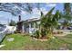 Side view of the house showing additional landscaping and a shed at 1757 New Hampshire Ne Ave, St Petersburg, FL 33703