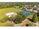 Aerial view of community amenities including tennis courts, volleyball courts, playground, and basketball court at 19606 Morden Blush Dr, Lutz, FL 33558