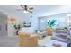 Bright living room with comfy seating and a large TV at 2450 Canadian Way # 6, Clearwater, FL 33763