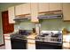Kitchen with double ovens and ample counter space at 3076 Eastland Blvd # 106, Clearwater, FL 33761