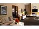 Spacious community room with comfortable seating and a fireplace at 3076 Eastland Blvd # 106, Clearwater, FL 33761