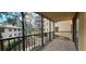 Balcony view overlooking the community's lush surroundings and neighboring building at 3076 Eastland Blvd # 106, Clearwater, FL 33761
