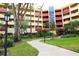Exterior view of the building and the landscaped grounds at 3076 Eastland Blvd # 106, Clearwater, FL 33761