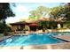 Refreshing community pool with lounge chairs at 3076 Eastland Blvd # 106, Clearwater, FL 33761