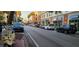 Image shows cars parked along a city street, suggesting convenient parking options at 3076 Eastland Blvd # 106, Clearwater, FL 33761