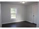 Bright bedroom with dark wood floors and neutral walls at 3623 N 52Nd St, Tampa, FL 33619