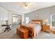 Bright main bedroom with mirrored closet doors and a dresser at 36730 Tara Ave, Zephyrhills, FL 33542