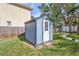 Blue shed with white door in grassy backyard at 5814 S 6Th St, Tampa, FL 33611