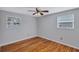 Bright bedroom with hardwood floors and ceiling fan at 5814 S 6Th St, Tampa, FL 33611