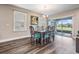 Dining room with sliding doors to backyard view at 7775 Abby Brooks Cir, Wesley Chapel, FL 33545