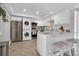 Modern kitchen with white shaker cabinets, stainless steel appliances, and marble countertops at 9000 Commodore Dr # 401, Seminole, FL 33776