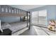 Bedroom with bunk beds and a large window at 9000 Commodore Dr # 401, Seminole, FL 33776