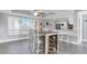 Charming dining area with a built-in shelving unit and modern light fixture at 9000 Commodore Dr # 401, Seminole, FL 33776