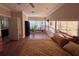 Bright bedroom with large windows, hardwood floors, and a cozy bed at 94 The Cove Way, Indian Rocks Beach, FL 33785