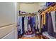 Large walk-in closet with ample shelving and hanging space at 94 The Cove Way, Indian Rocks Beach, FL 33785