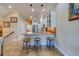 Kitchen island with seating for three and granite countertop at 94 The Cove Way, Indian Rocks Beach, FL 33785