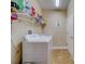 Convenient laundry room with washer, dryer, and storage at 94 The Cove Way, Indian Rocks Beach, FL 33785