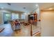 Living room with tiled floors, sectional sofa, and access to balcony at 94 The Cove Way, Indian Rocks Beach, FL 33785