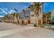 Exterior view of townhouses with garages and landscaping at 94 The Cove Way, Indian Rocks Beach, FL 33785