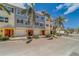 Two-story townhouses with gray and yellow exterior at 94 The Cove Way, Indian Rocks Beach, FL 33785