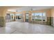 Bright sunroom with water views undergoing renovation at 11325 4Th E St, Treasure Island, FL 33706