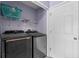 Laundry room with washer, dryer, and shelving at 2102 Deltona Blvd, Spring Hill, FL 34606