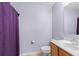Clean bathroom with a toilet, sink, and shower/tub combo at 2102 Deltona Blvd, Spring Hill, FL 34606