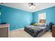 Bedroom with a queen-size bed, dresser, and window at 2102 Deltona Blvd, Spring Hill, FL 34606