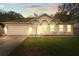 Inviting house exterior with a two-car garage at 2102 Deltona Blvd, Spring Hill, FL 34606