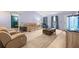 Living room with sofas, coffee table and fish tank at 2102 Deltona Blvd, Spring Hill, FL 34606