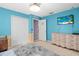 Bright bedroom with double doors and a large dresser at 2102 Deltona Blvd, Spring Hill, FL 34606