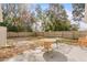 Fenced backyard with patio and trees at 2102 Deltona Blvd, Spring Hill, FL 34606