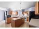 Kitchen with island, wood cabinets, and stainless steel appliances at 2102 Deltona Blvd, Spring Hill, FL 34606