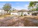 Large backyard with a patio and plenty of space at 2102 Deltona Blvd, Spring Hill, FL 34606